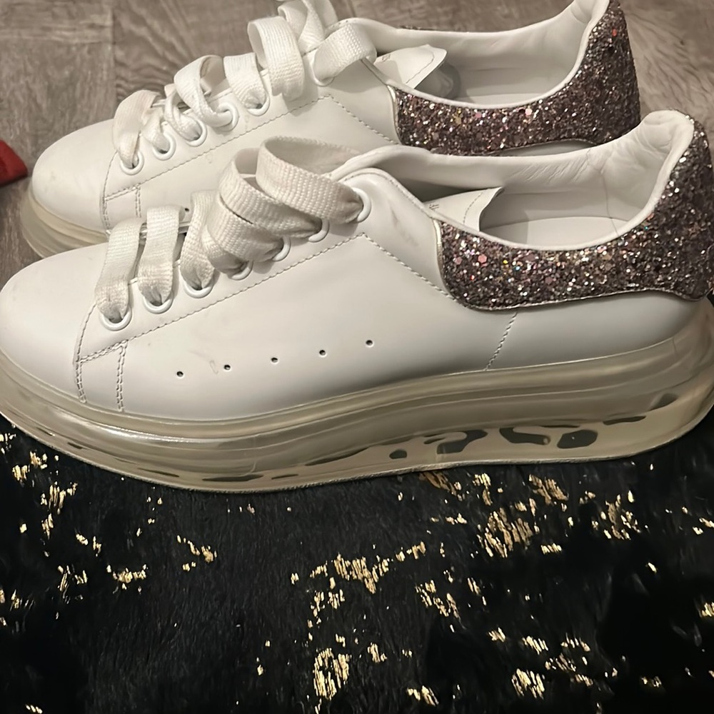 white alexander mcqueens with glitter on the back